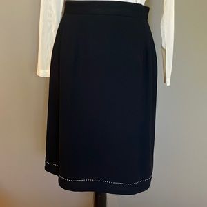 Black fully lined skirt.